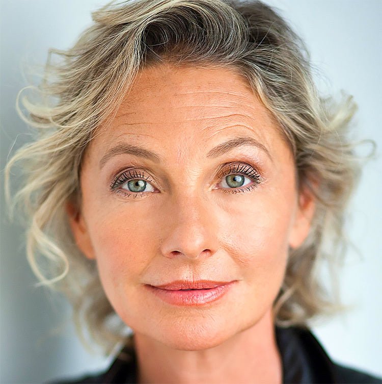 Lifting makeup portrait of a woman with smooth, radiant skin and natural glow